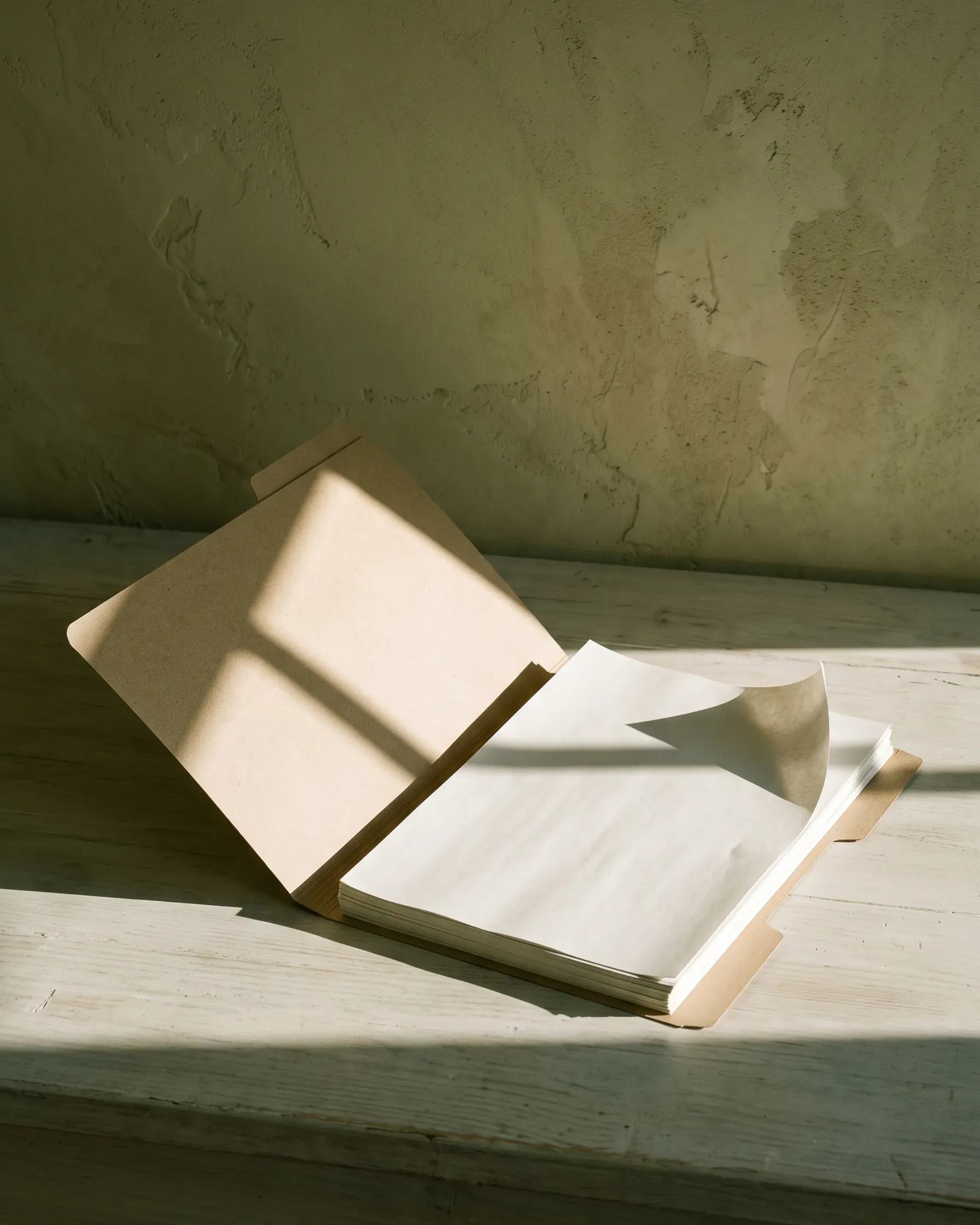 A folder of invoices on a desk