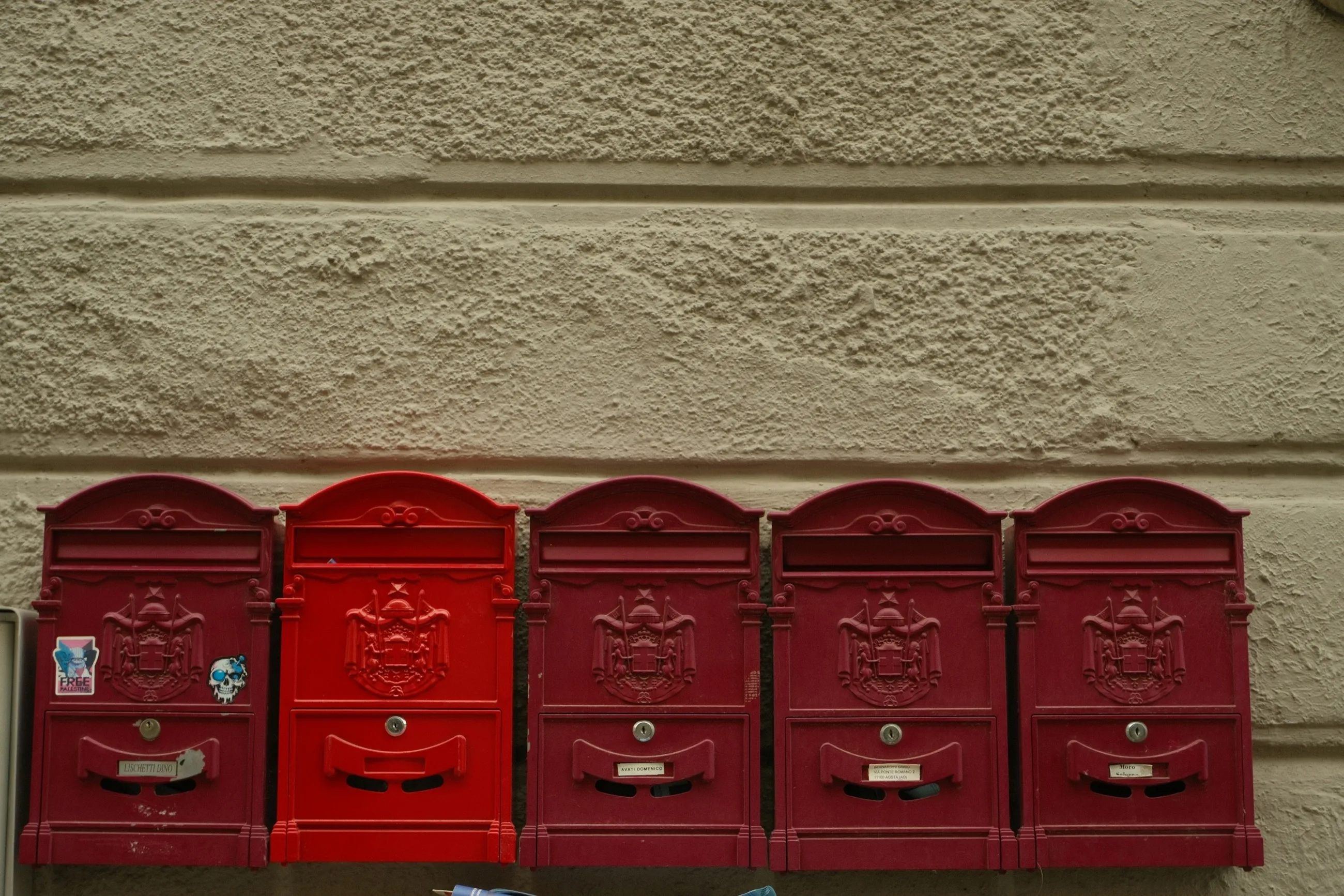 A wall of letterboxes in an apartment building